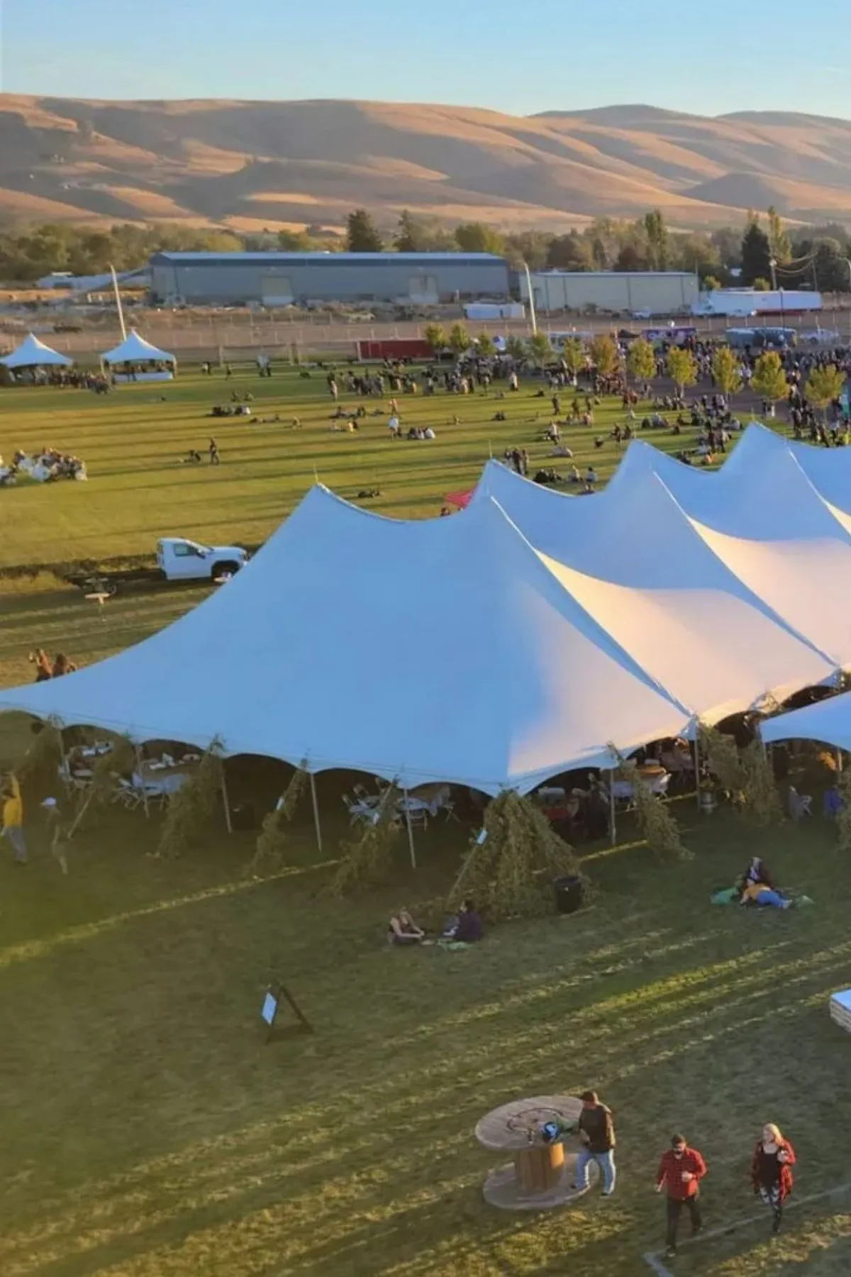 sky view of flag football fields and large white tent for shade